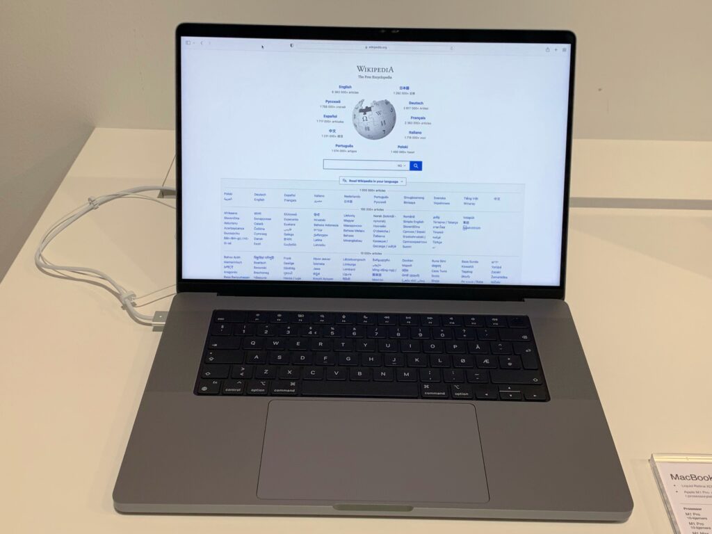 Open 16-inch Apple MacBook Pro on a display table