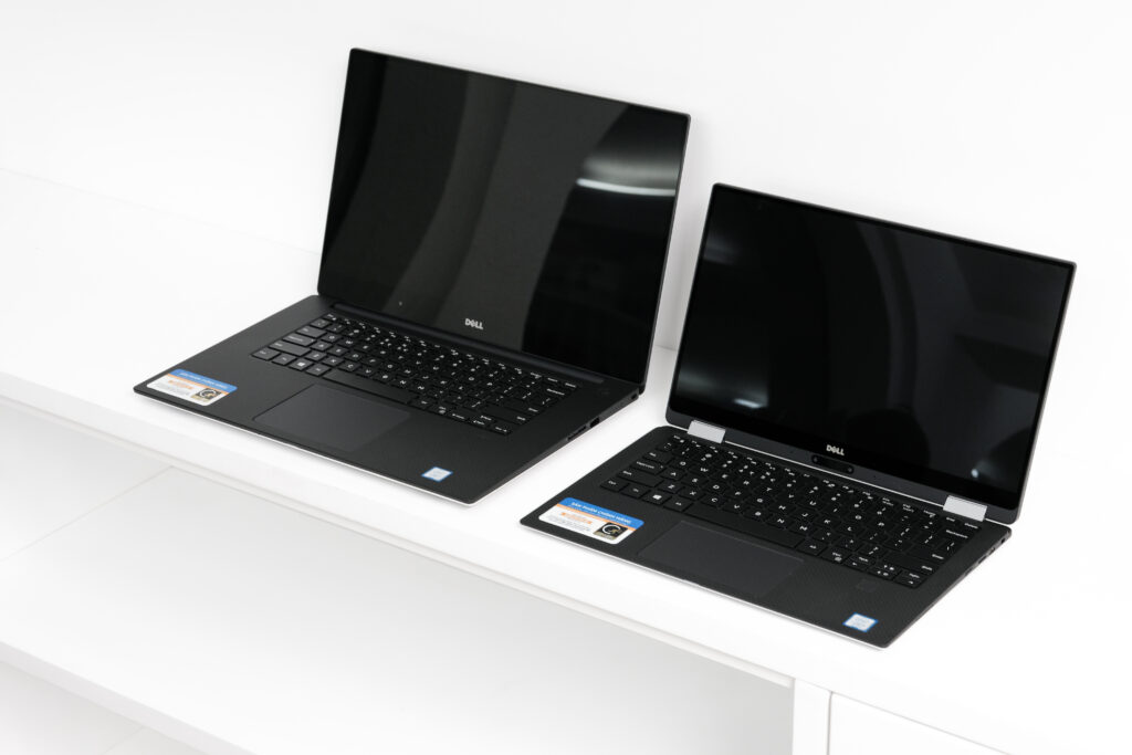 Dell XPS 13 and XPS 15 laptops displayed side by side