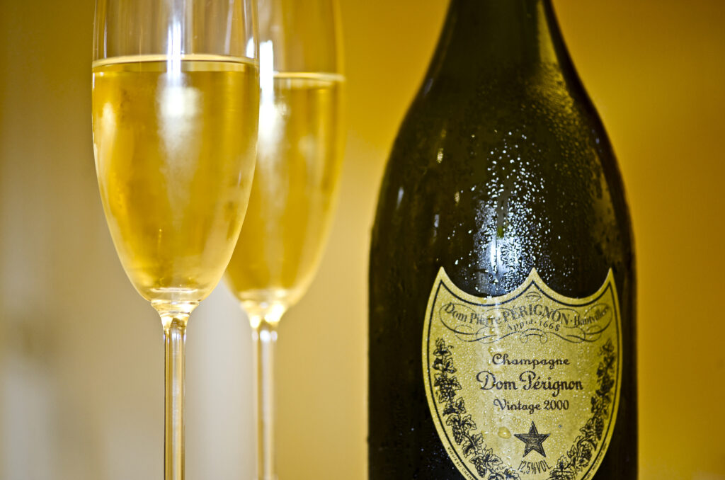 A Dom Pérignon Vintage 2000 bottle beside Champagne glasses