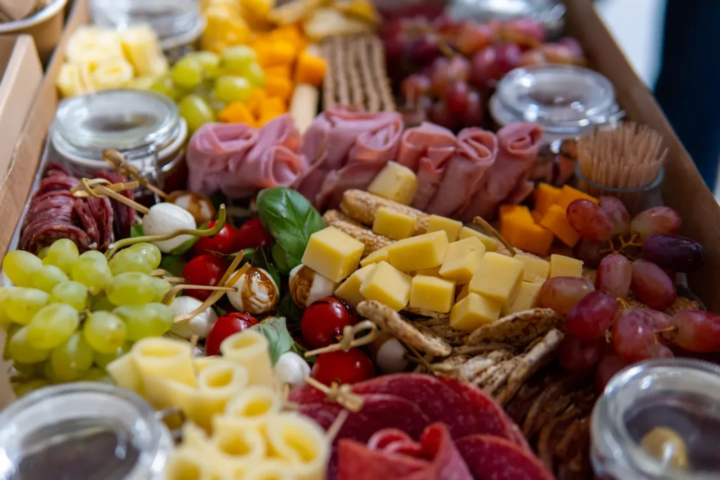 A charcuterie board with cheese, cured meats and accompaniments